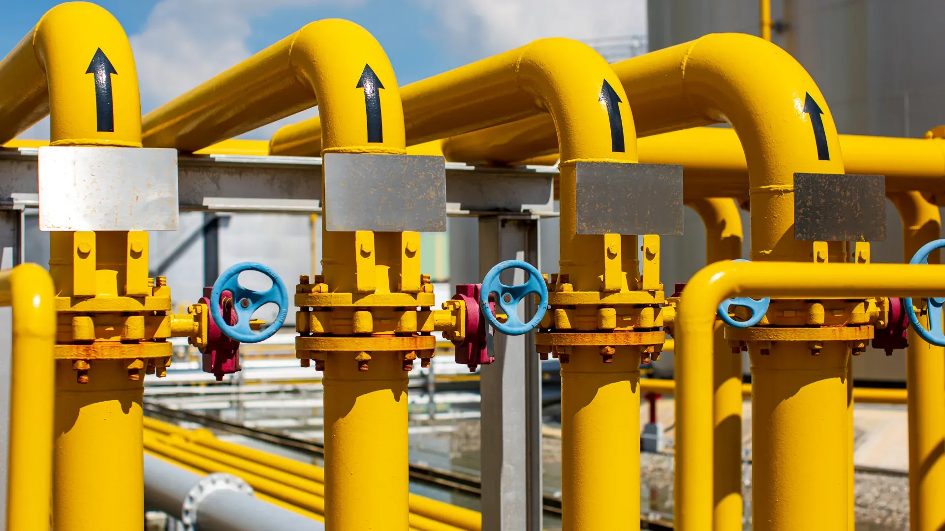 Industrial yellow pipes at a mineral processing plant